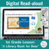Laptop computer screen showing A Library Book for Bear Digital Read-aloud title slide with 2 banners reading Digital Read-aloud and 1st Grade Lesson A Library Book for Bear.